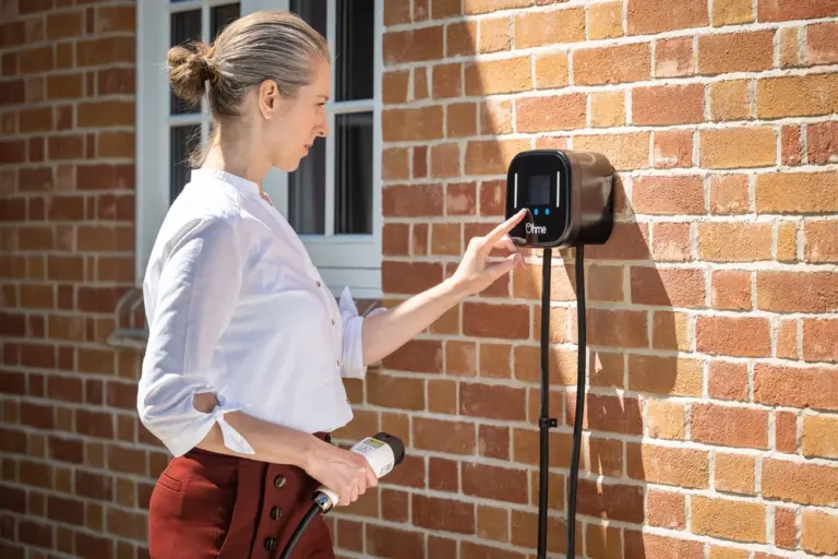 Woman using Ohme charger