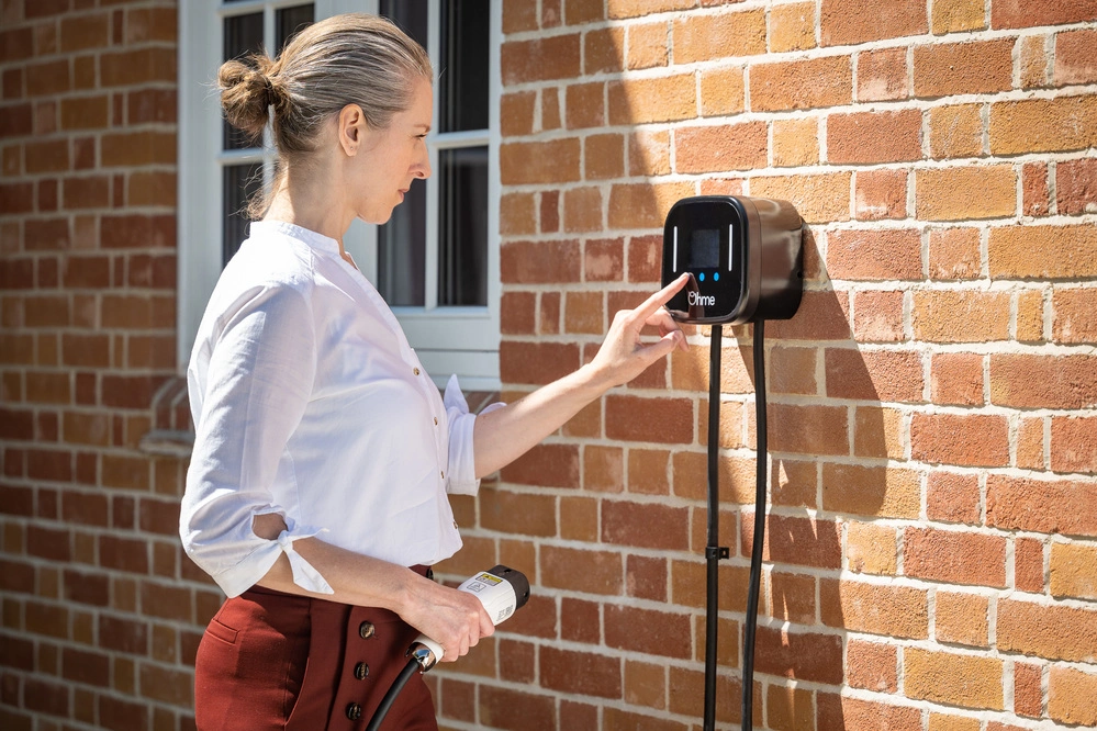 Woman using Ohme charger