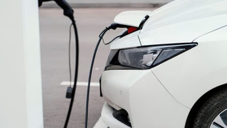 Vehicle plugged into a charger in the front