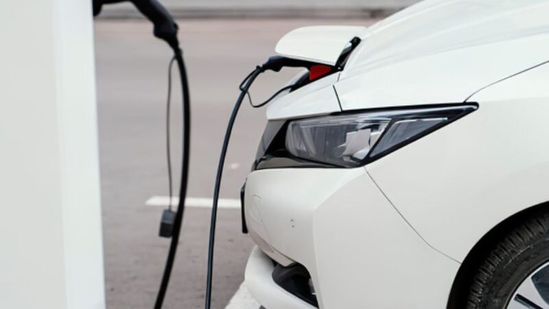 Vehicle plugged into a charger in the front