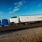 Revoy battery between tractor and trailer