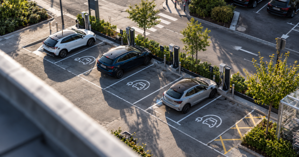 Car park from the top with some EVs charging