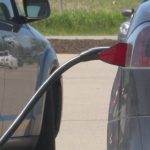 Charging connector plugged into Tesla